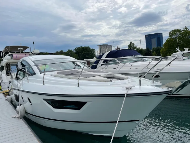 Slide: The Image of 2018 Beneteau Gran Turismo 40 yacht docked at marina under cloudy sky. - 33