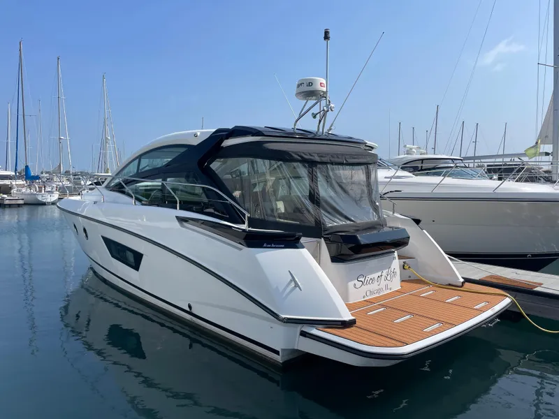 Slide: The Image of 2018 Beneteau Gran Turismo 40 yacht docked in marina, rear view. - 4