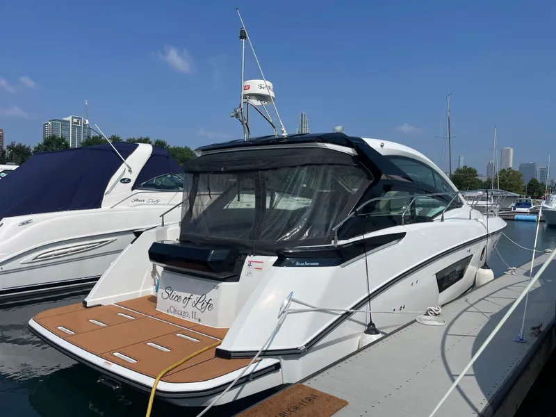Slide: The Image of 2018 Beneteau Gran Turismo 40 yacht docked at marina, rear view. - 5