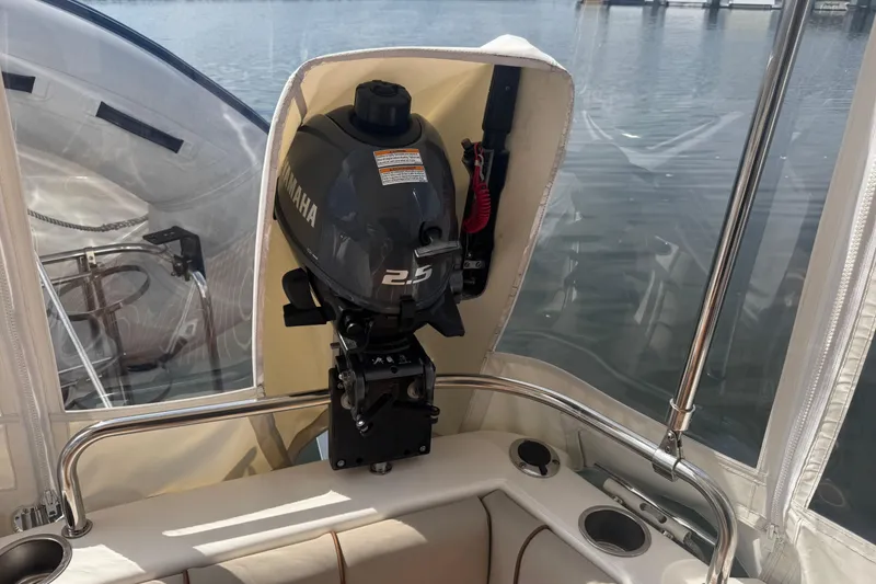 Slide: The Image of 2020 Cutwater C-30 CB boat with Yamaha 2.5 outboard motor, docked on calm water. - 12