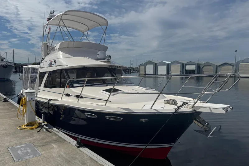 Slide: The Image of 2020 Cutwater C-30 CB yacht docked at marina under cloudy sky. - 5