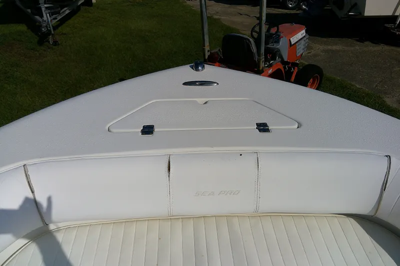 Slide: The Image of 2007 Sea Pro 186 CC boat interior with white seating and storage compartment. - 12