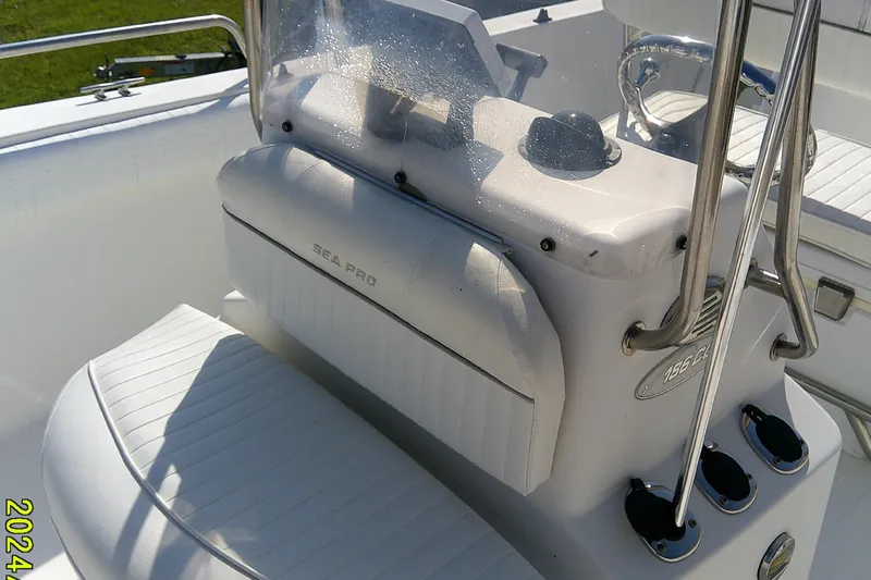 Slide: The Image of 2007 Sea Pro 186 CC boat console with white seating and stainless steel railings. - 16