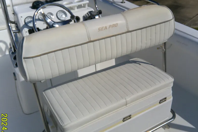 Slide: The Image of 2007 Sea Pro 186 CC boat interior with white cushioned seating and steering console. - 20