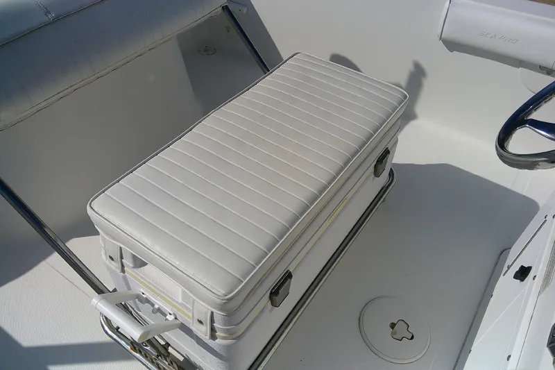 Slide: The Image of 2007 Sea Pro 186 CC boat interior with white cushioned seating and steering wheel. - 24