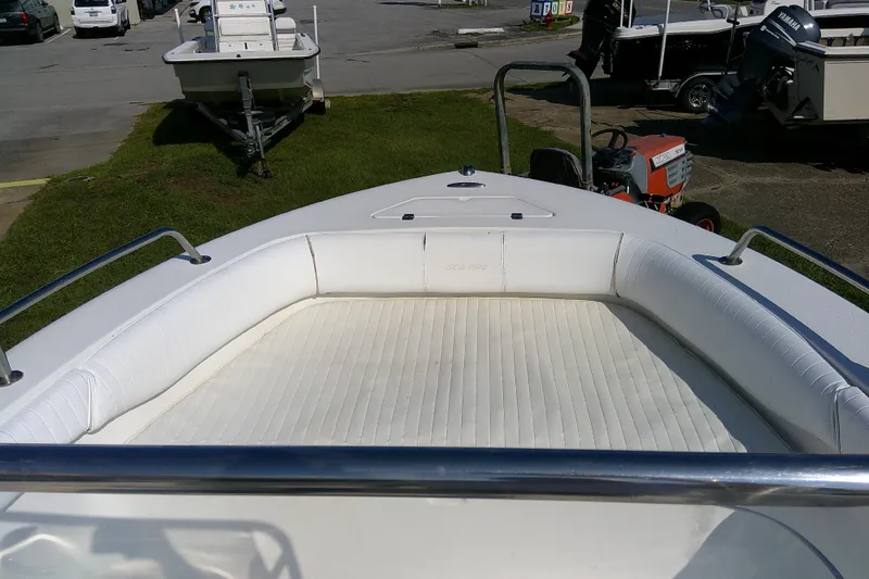 Slide: The Image of 2007 Sea Pro 186 CC boat with white cushioned seating and stainless steel railings. - 25