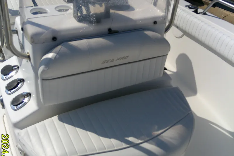 Slide: The Image of 2007 Sea Pro 186 CC boat interior with white seating and control panel. - 15