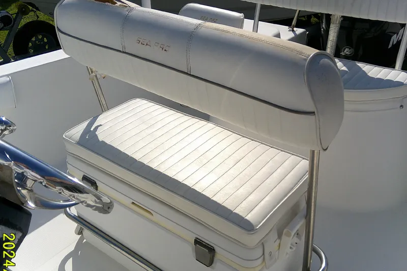 Slide: The Image of 2007 Sea Pro 186 CC boat interior with white cushioned seating and storage. - 17