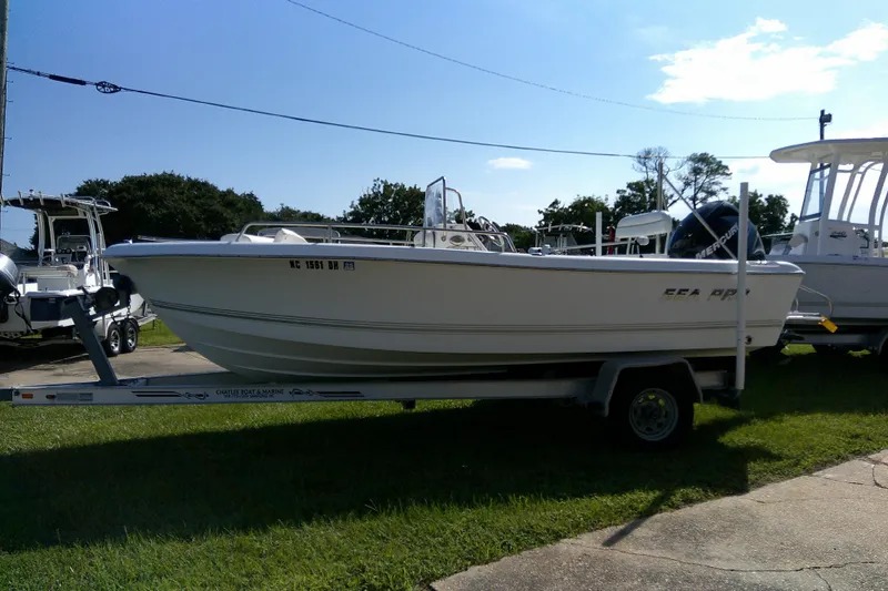 Slide: The Image of 2007 Sea Pro 186 CC boat on trailer, parked outdoors on grass. - 4