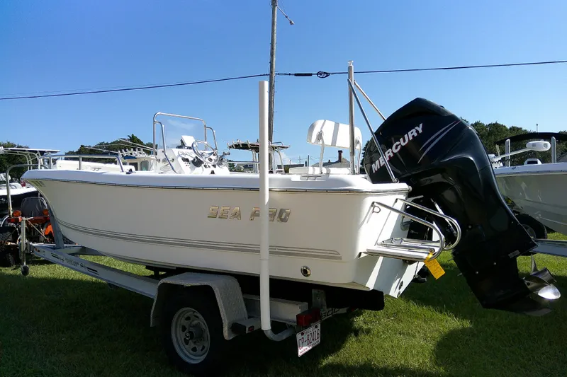 Slide: The Image of 2007 Sea Pro 186 CC boat with Mercury outboard motor on trailer, parked on grass. - 5