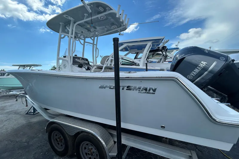 Slide: The Image of 2021 Sportsman Open 232 Center Console boat on trailer, featuring Yamaha engine. - 3