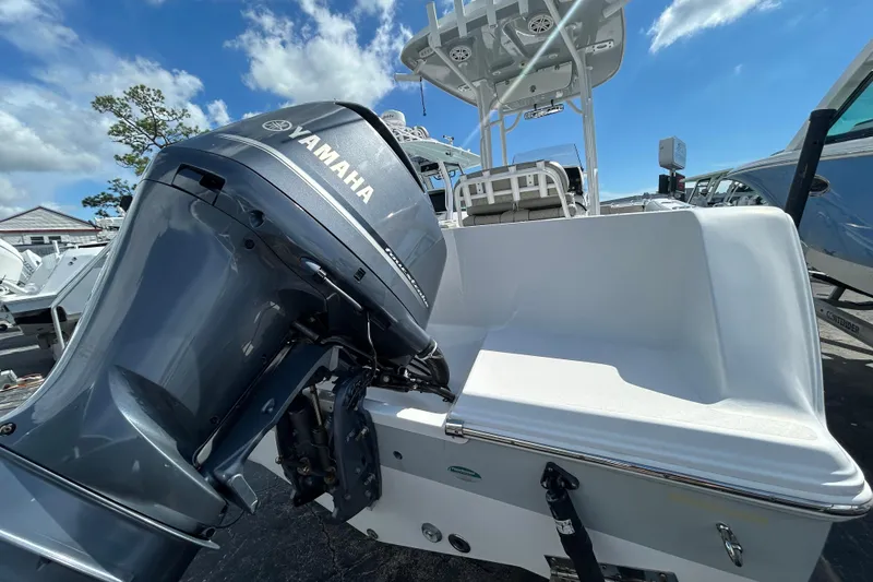 Slide: The Image of 2021 Sportsman Open 232 Center Console boat with Yamaha outboard motor, sunny day. - 6