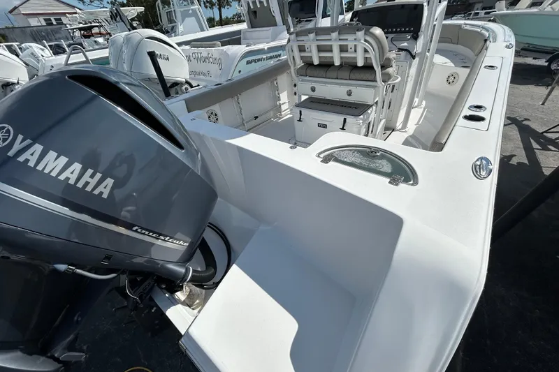 Slide: The Image of 2021 Sportsman Open 232 Center Console boat with Yamaha outboard engine. - 8