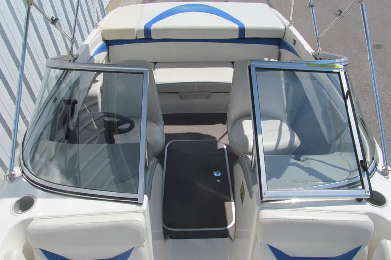 Slide: The Image of 2007 Bayliner 185 boat interior with open windshield and seating area. - 10