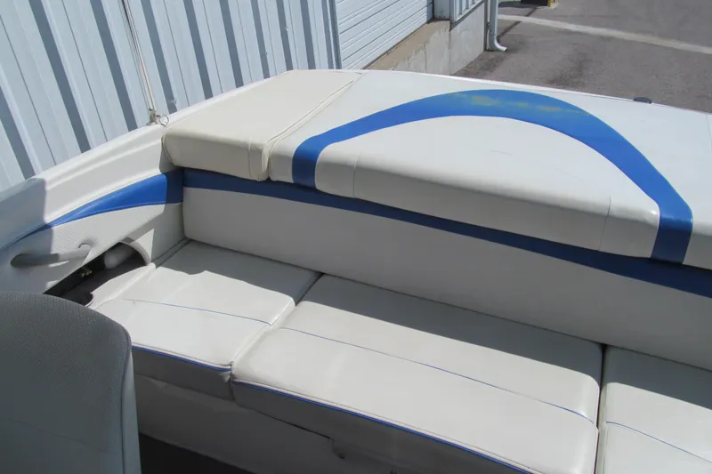 Slide: The Image of 2007 Bayliner 185 boat interior with white and blue seating. - 11