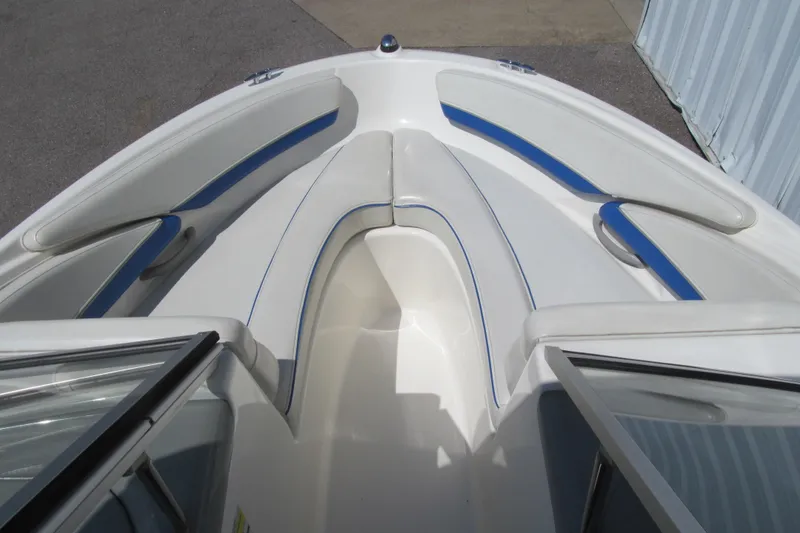 Slide: The Image of 2007 Bayliner 185 boat interior with white and blue seating. - 8