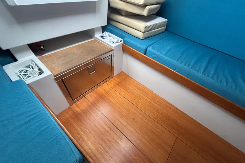 Slide: The Image of Interior of 2019 Saffier Sc 8.0m Cabin with blue seating and wooden flooring. - 15