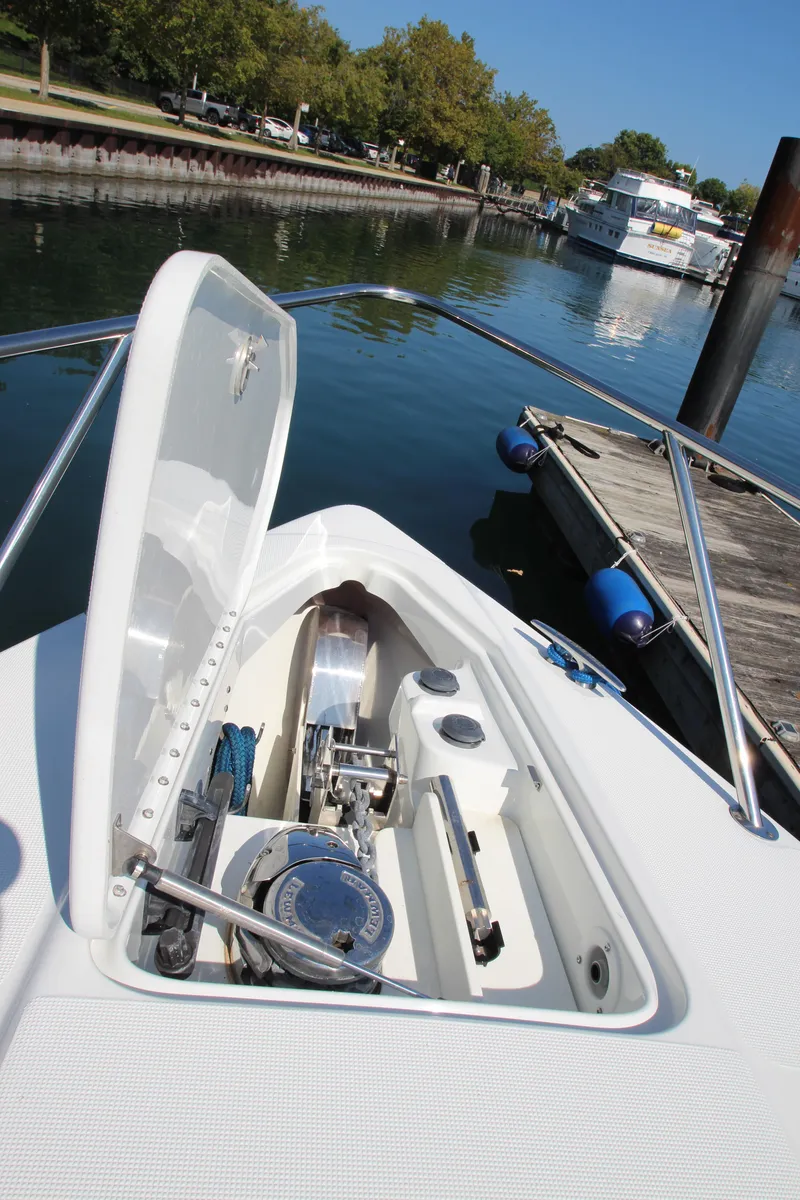 Slide: The Image of 2012 Formula 400 Super Sport boat anchor compartment at a marina. - 11
