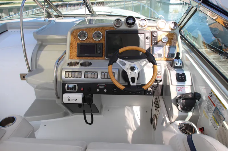 Slide: The Image of 2012 Formula 400 Super Sport boat cockpit with advanced navigation controls and steering wheel. - 14