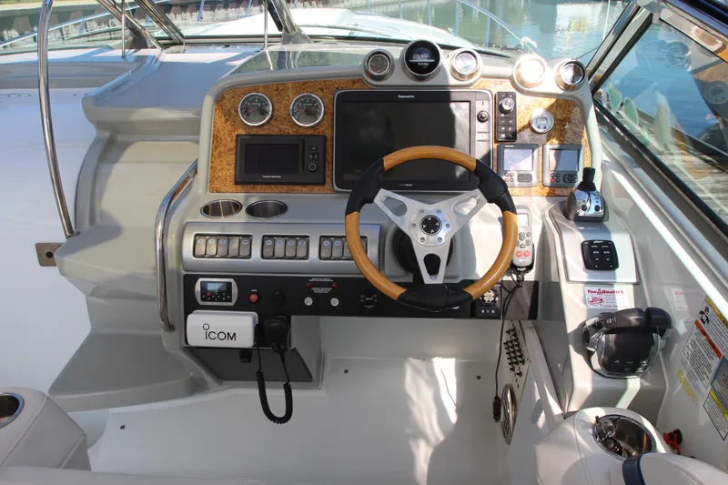 Slide: The Image of 2012 Formula 400 Super Sport boat cockpit with steering wheel and control panel. - 15