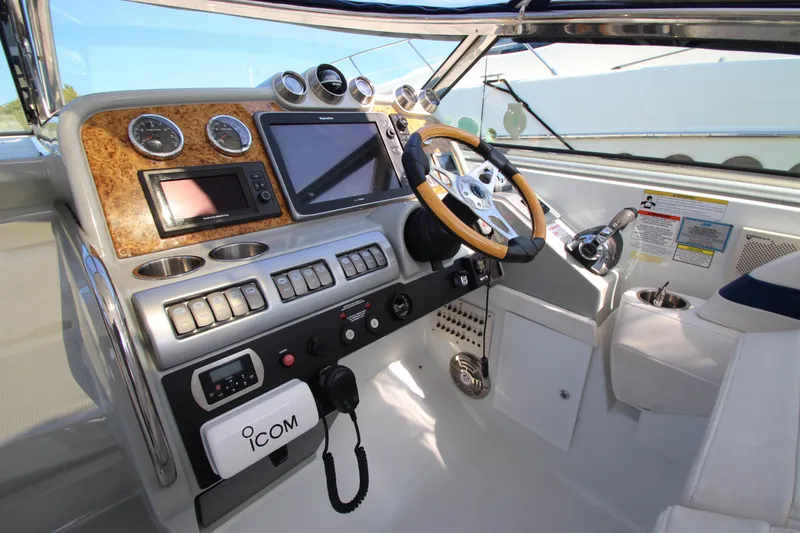Slide: The Image of 2012 Formula 400 Super Sport boat cockpit with advanced navigation and control systems. - 18