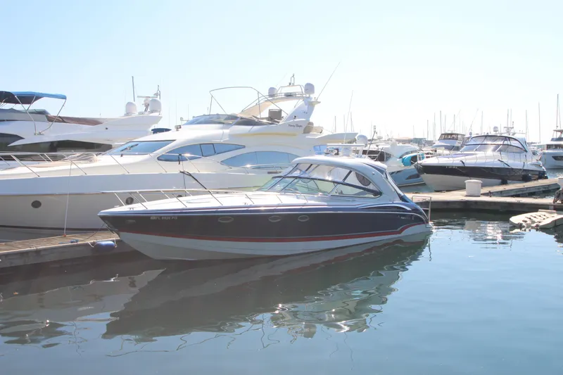 Slide: The Image of 2012 Formula 400 Super Sport yacht docked at marina. - 2