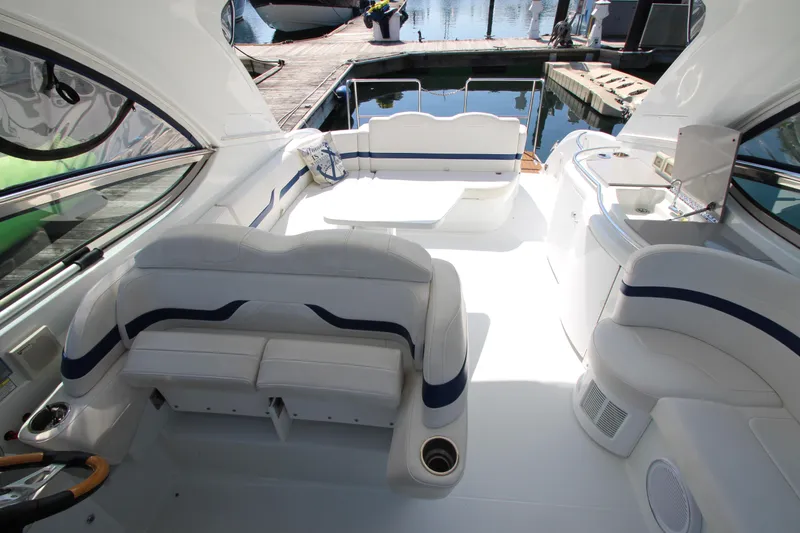 Slide: The Image of 2012 Formula 400 Super Sport boat interior with white and blue seating. - 21