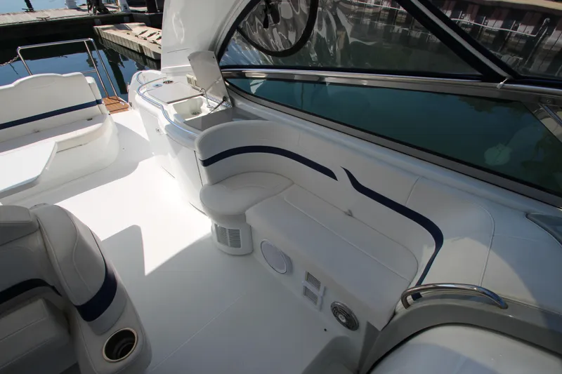 Slide: The Image of 2012 Formula 400 Super Sport boat interior with white and blue seating. - 22