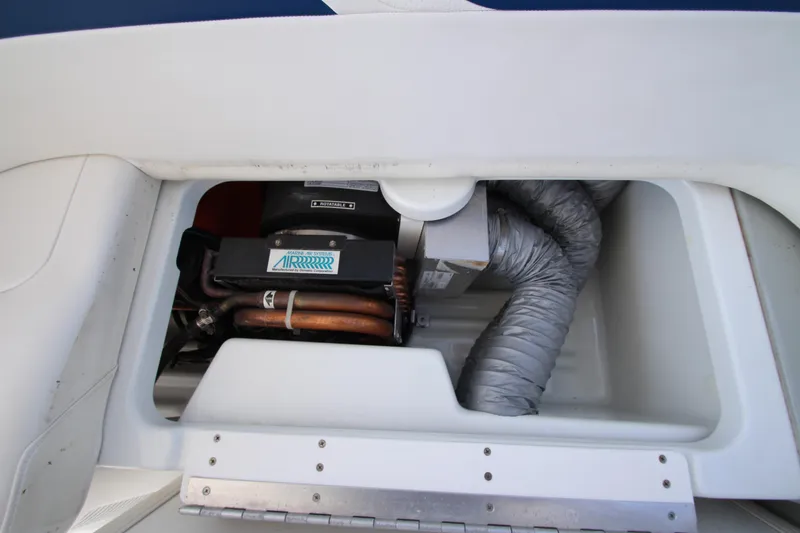 Slide: The Image of 2012 Formula 400 Super Sport engine compartment with visible components. - 23