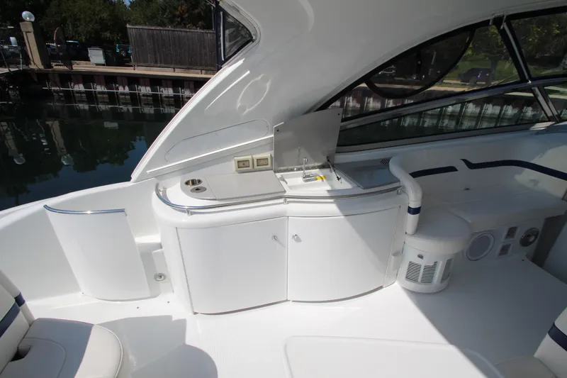 Slide: The Image of 2012 Formula 400 Super Sport boat interior with kitchenette and seating area. - 25