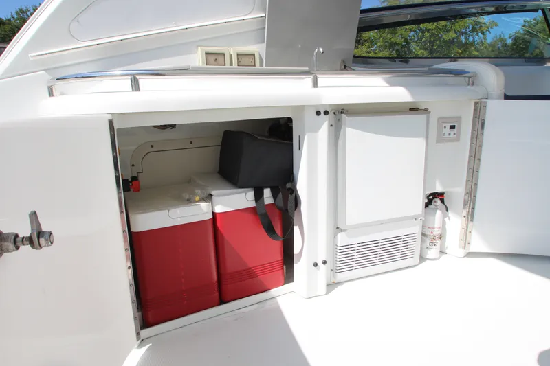 Slide: The Image of Storage compartment on a 2012 Formula 400 Super Sport boat with coolers and a refrigerator. - 27