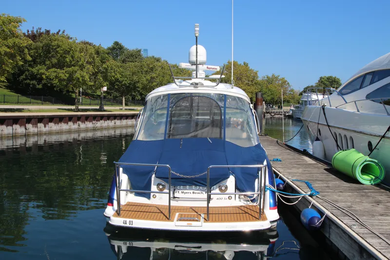 Slide: The Image of 2012 Formula 400 Super Sport yacht docked at marina. - 3