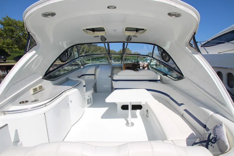 Slide: The Image of 2012 Formula 400 Super Sport boat interior with white seating and table. - 30