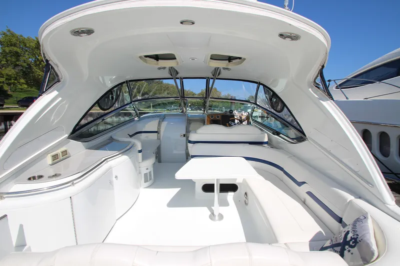 Slide: The Image of 2012 Formula 400 Super Sport boat interior with white seating and table. - 31