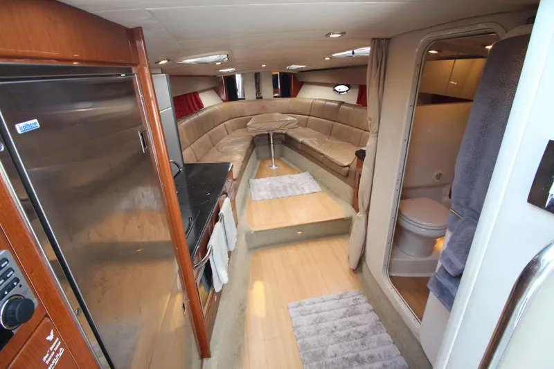 Slide: The Image of Interior of 2012 Formula 400 Super Sport yacht with kitchen, seating area, and bathroom. - 35