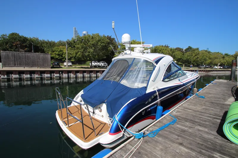 Slide: The Image of 2012 Formula 400 Super Sport boat docked at a marina. - 4