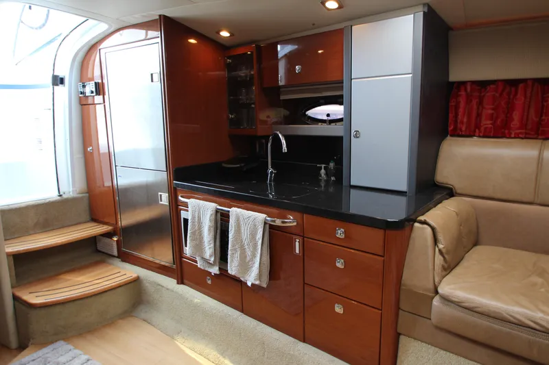 Slide: The Image of Interior of a 2012 Formula 400 Super Sport yacht with modern kitchen amenities. - 40