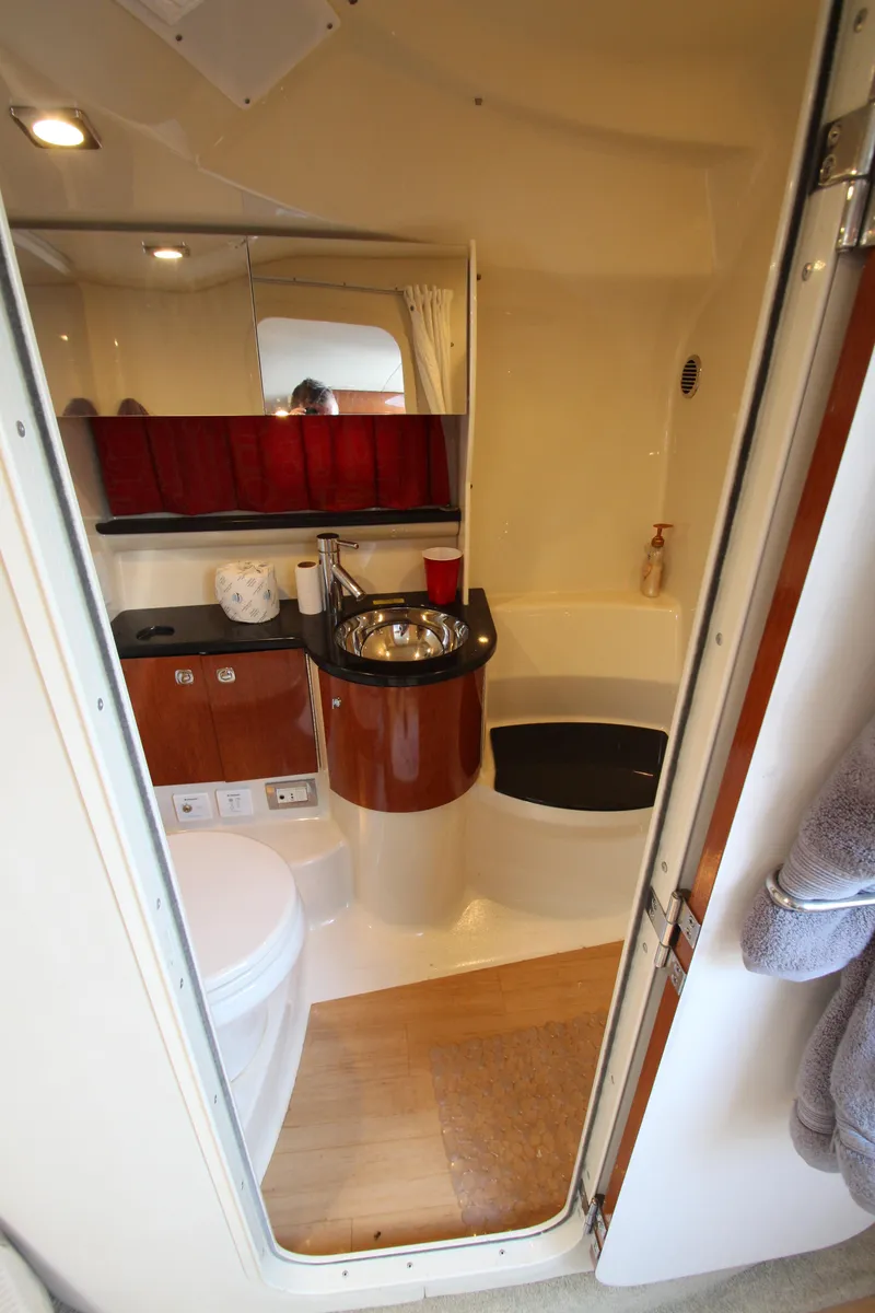 Slide: The Image of 2012 Formula 400 Super Sport yacht bathroom with sink, toilet, and shower. - 43
