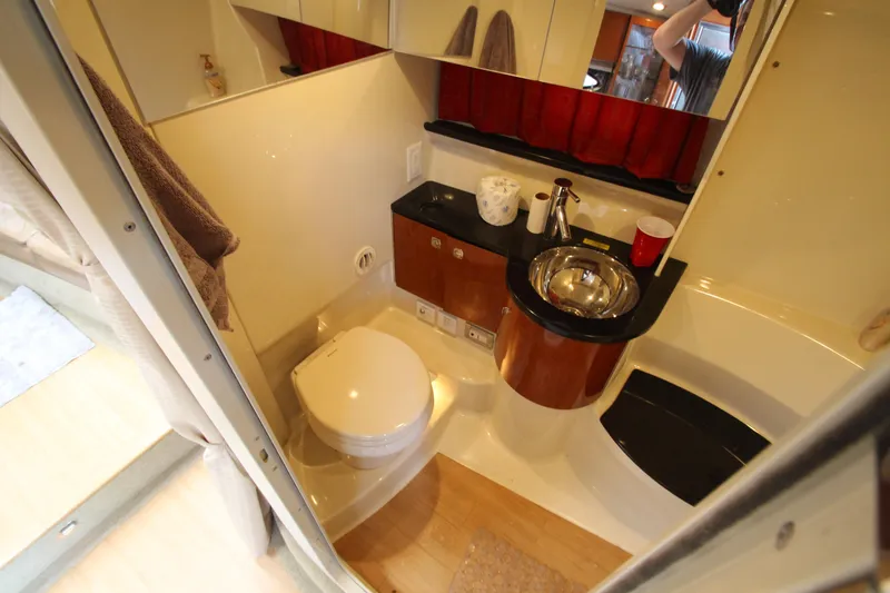 Slide: The Image of 2012 Formula 400 Super Sport yacht bathroom with toilet, sink, and shower. - 44