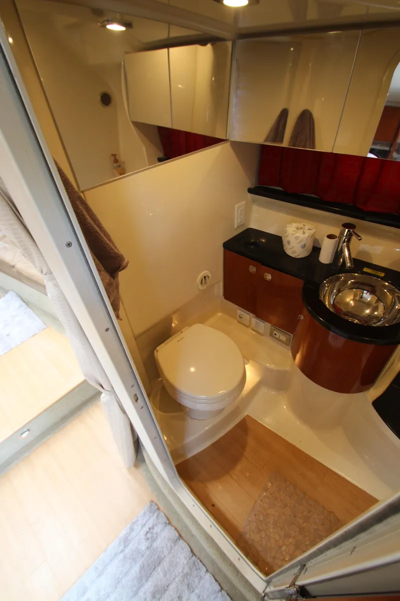 Slide: The Image of 2012 Formula 400 Super Sport yacht bathroom with modern fixtures and wooden accents. - 45