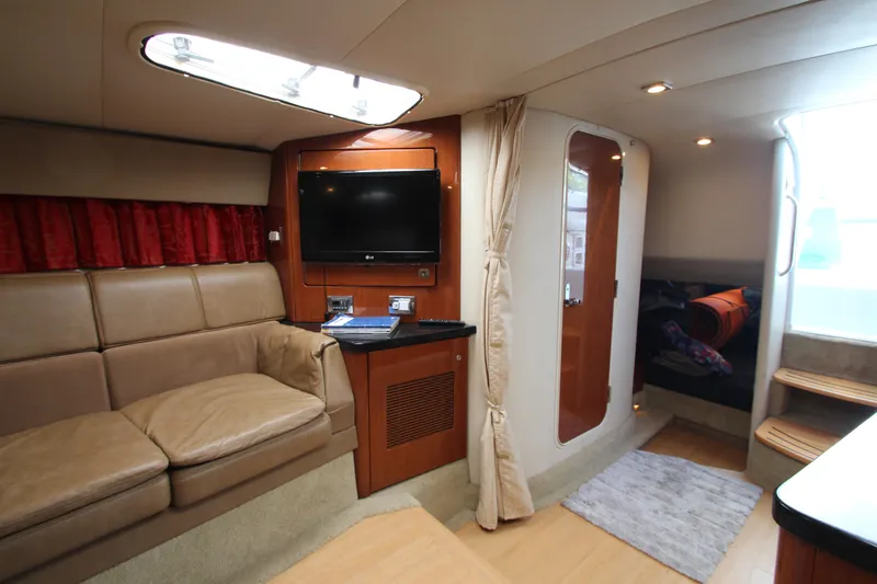 Slide: The Image of Interior of a 2012 Formula 400 Super Sport yacht with leather seating and TV. - 49