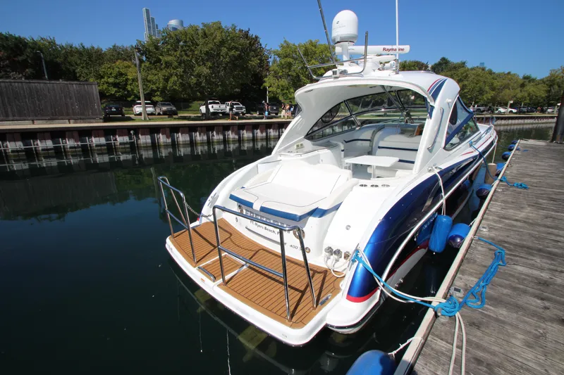 Slide: The Image of 2012 Formula 400 Super Sport yacht docked at marina. - 6