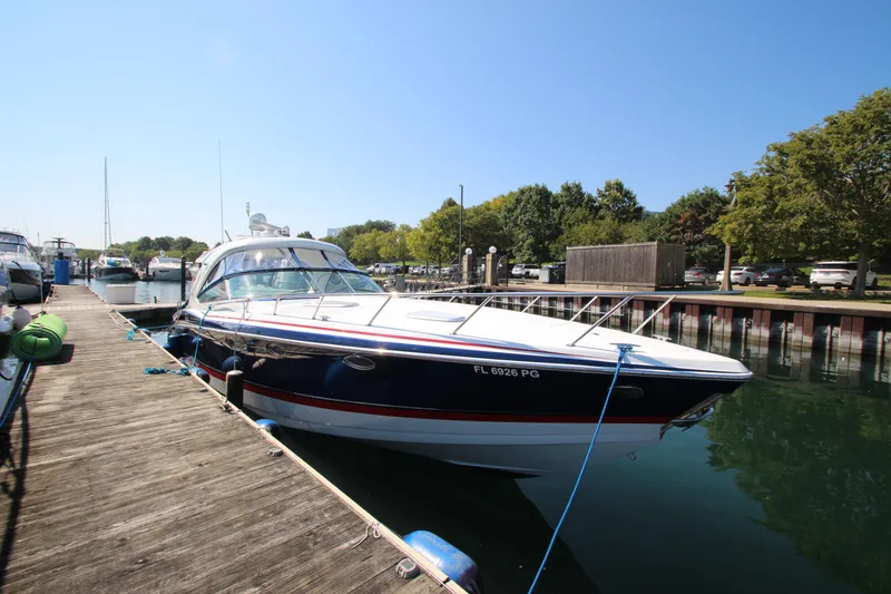 Slide: The Image of 2012 Formula 400 Super Sport boat docked at a marina on a sunny day. - 8