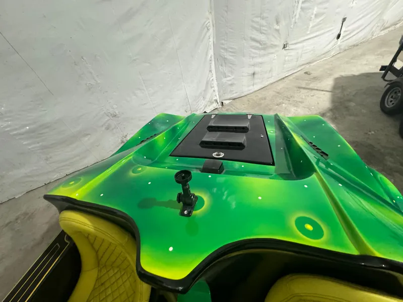 Slide: The Image of 2023 Watersports Car Series B with vibrant green design and yellow seats. - 11