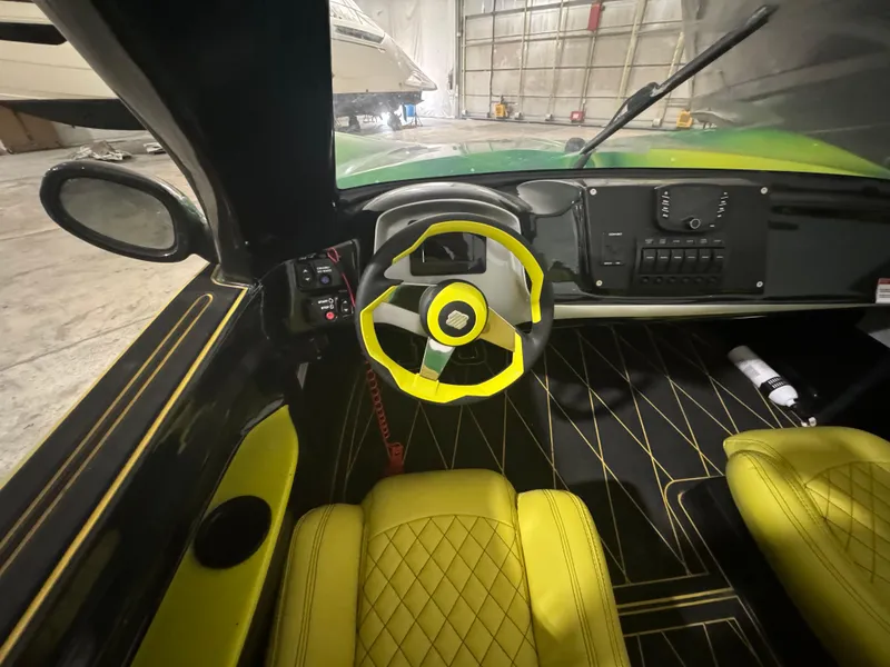 Slide: The Image of 2023 Watersports Car Series B interior with yellow accents and modern dashboard design. - 9