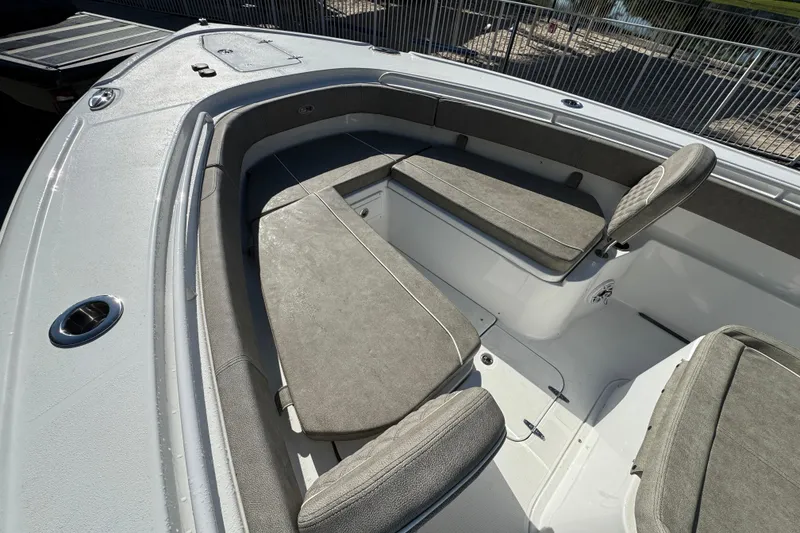 Slide: The Image of 2025 Sea Hunt Ultra 305 SE boat interior with cushioned seating and storage compartments. - 8