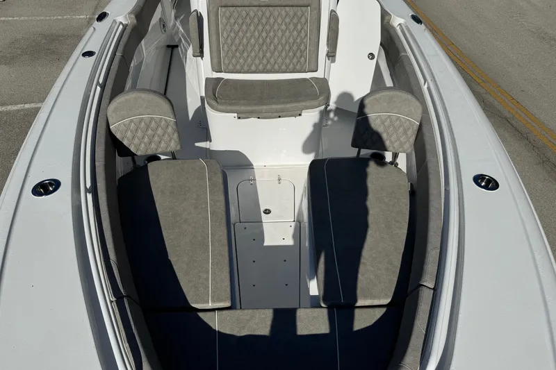 Slide: The Image of 2025 Sea Hunt Ultra 305 SE boat interior with gray cushioned seating. - 9
