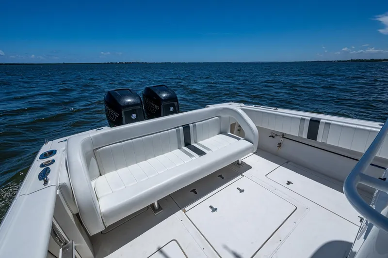 Slide: The Image of 2010 Intrepid 323 OPEN boat with dual engines on open water. - 18
