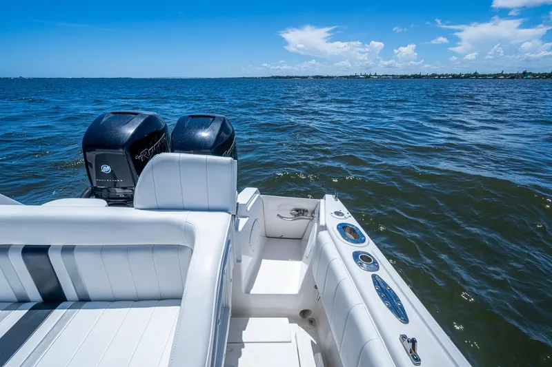 Slide: The Image of 2010 Intrepid 323 OPEN boat with dual engines on open water. - 33