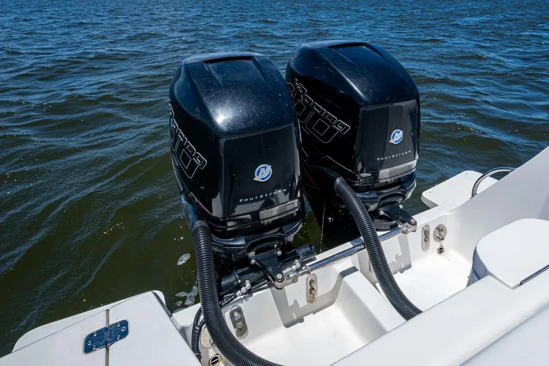 Slide: The Image of 2010 Intrepid 323 OPEN boat with dual Mercury outboard engines on water. - 36